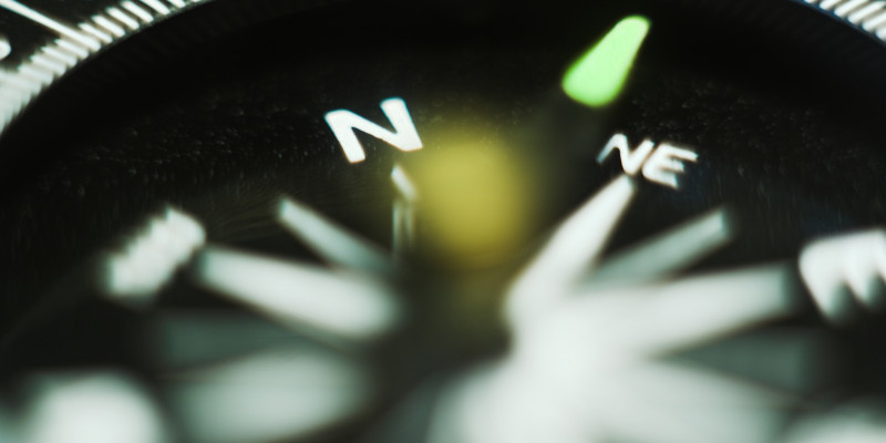 Close-up of a compass dial.